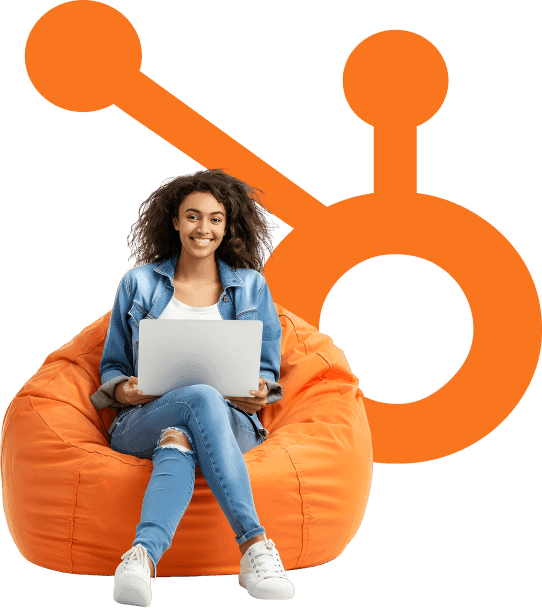 The HubSpot sprocket behind a person working on a laptop