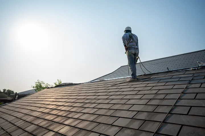 Residential roof with new asphalt shingles on a family home